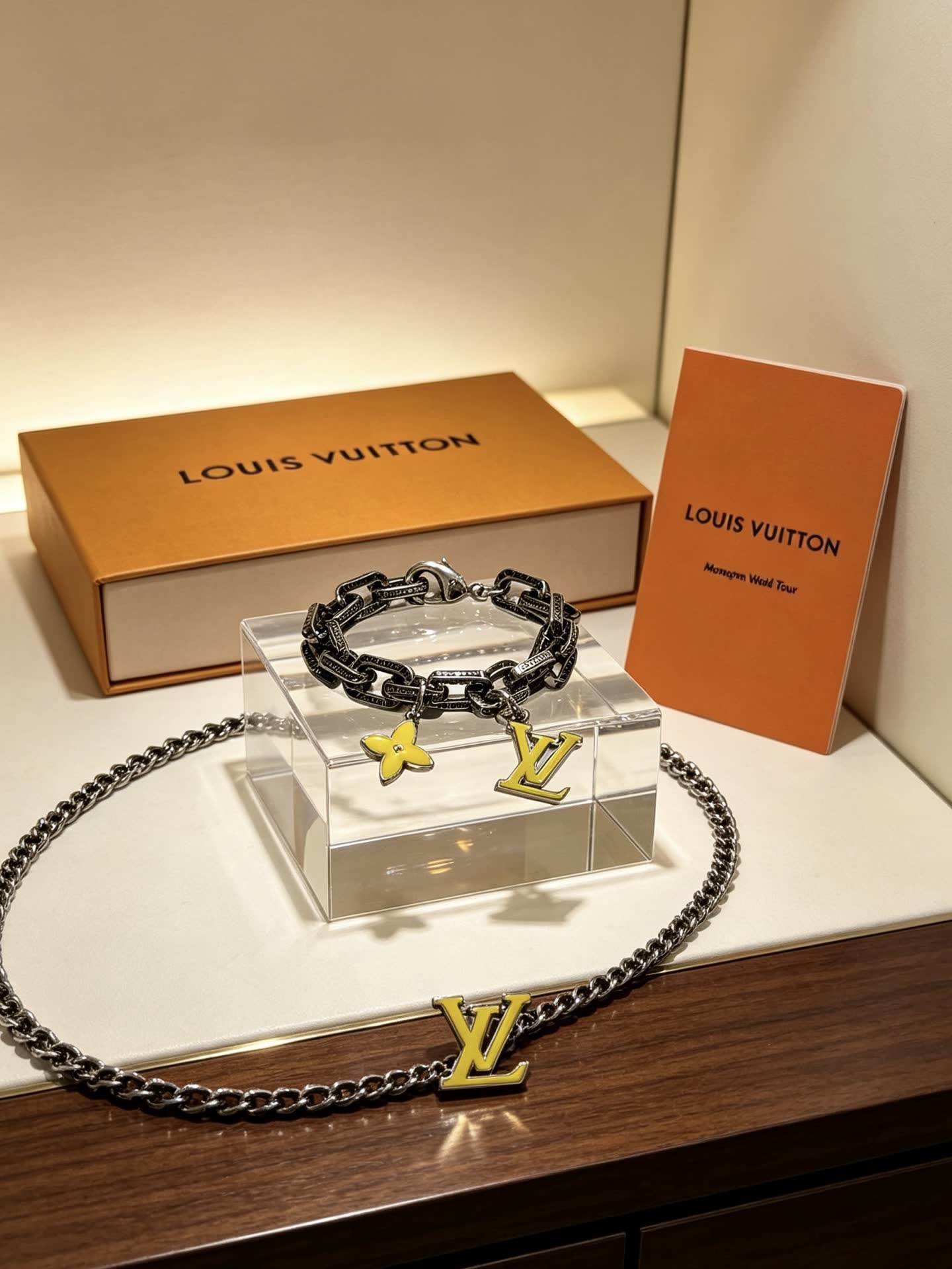 Louis Vuitton Silver Bracelet with LV Logo and Flower Charm